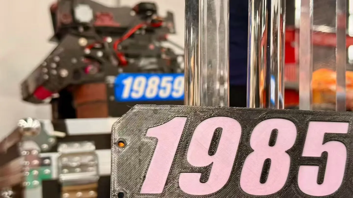 Competition robot beside a trophy